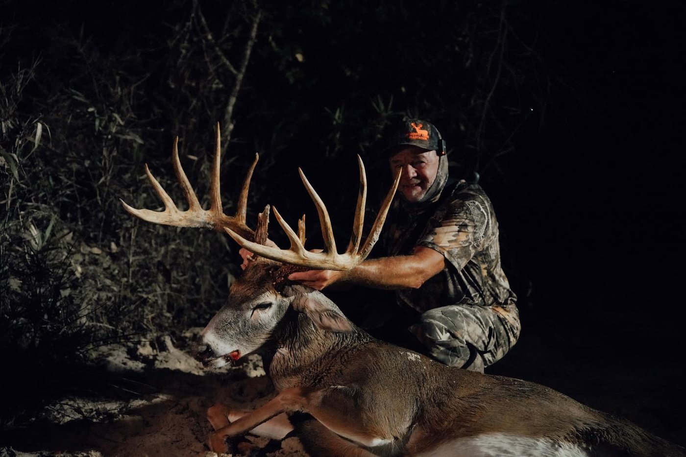 Hunter with trophy whitetail buck at Mosquito Creek Plantation Florida
